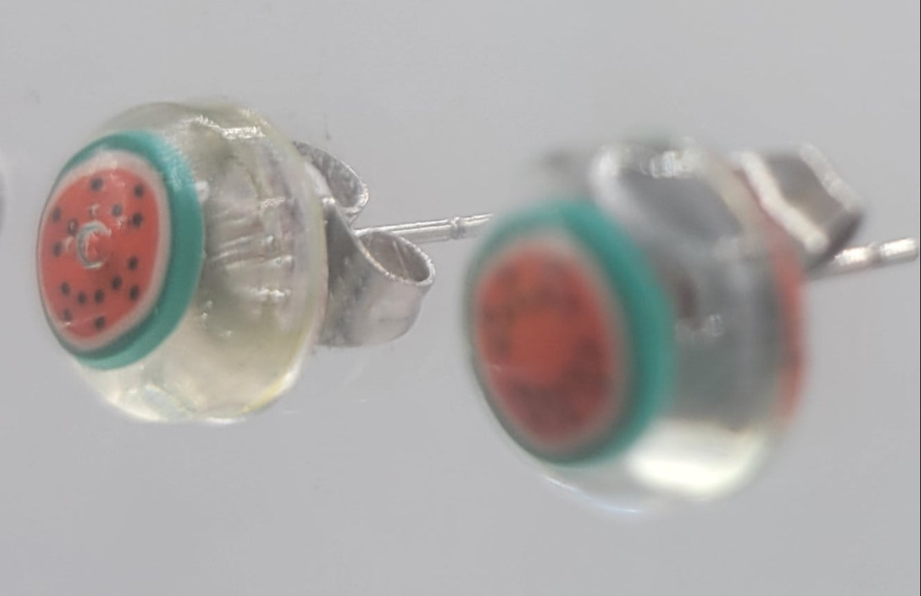 Close-up of colorful earrings on a white background