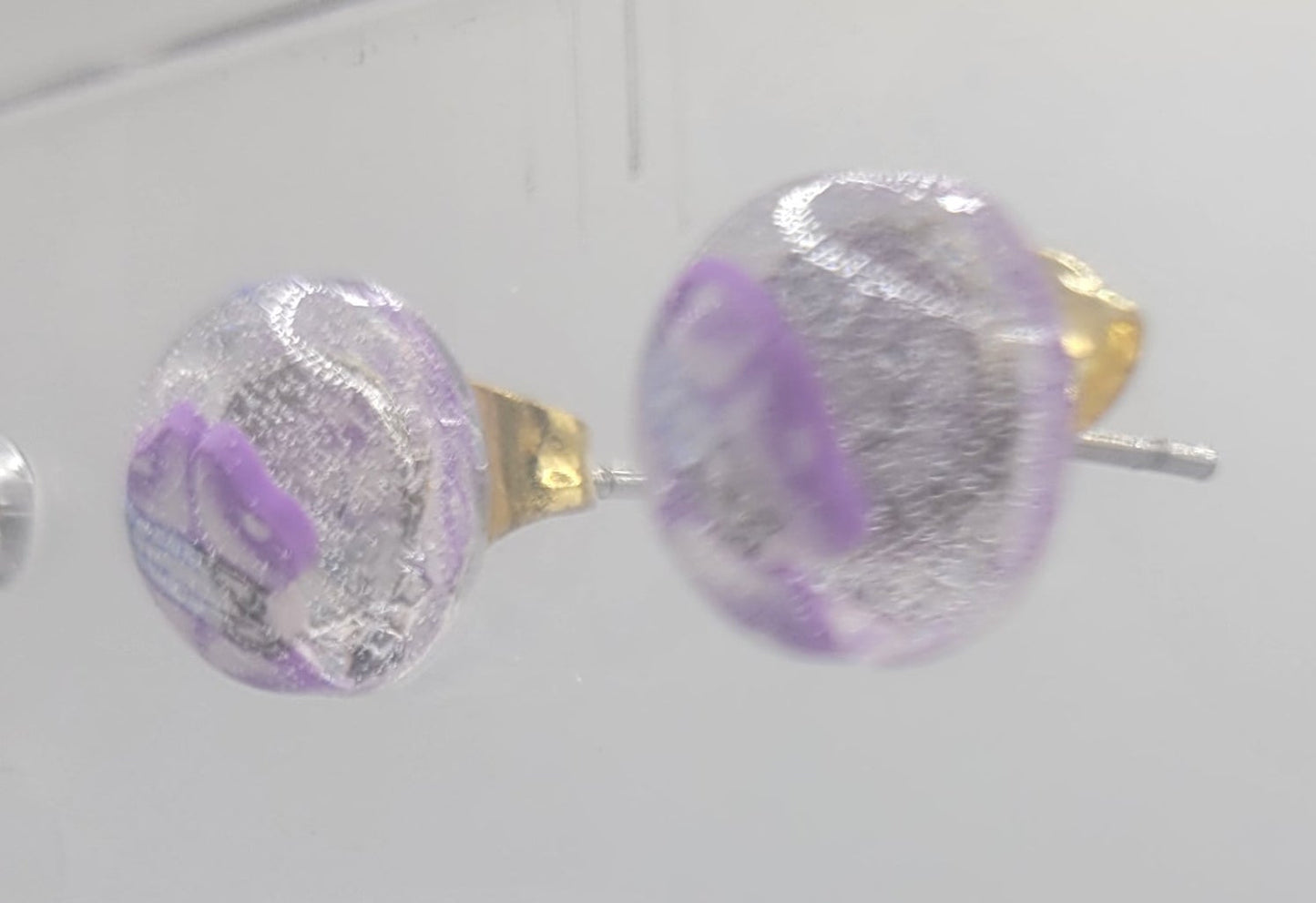 Close-up of colorful earrings on a white background
