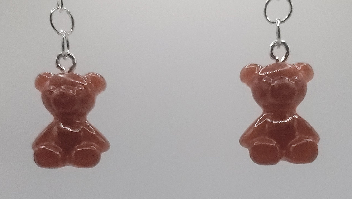 Brown teddy bear earrings on a white background