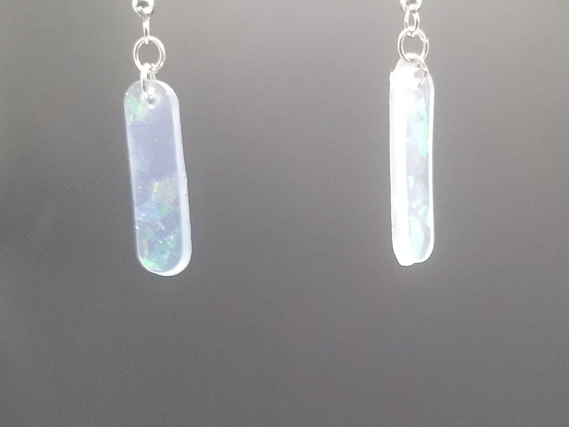 Opalite bar earrings on a gray background