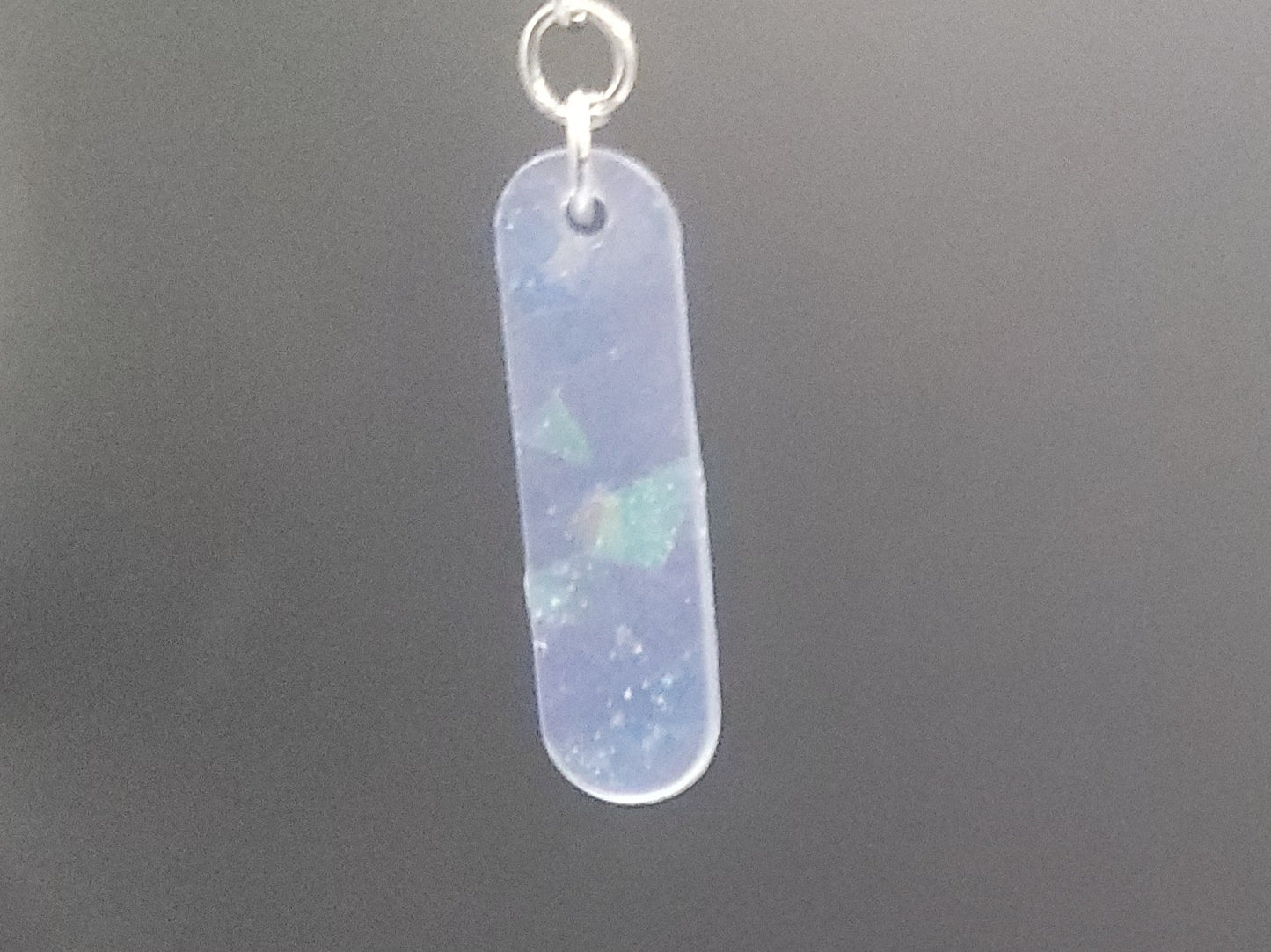 Opalite bar earrings on a dark gray background