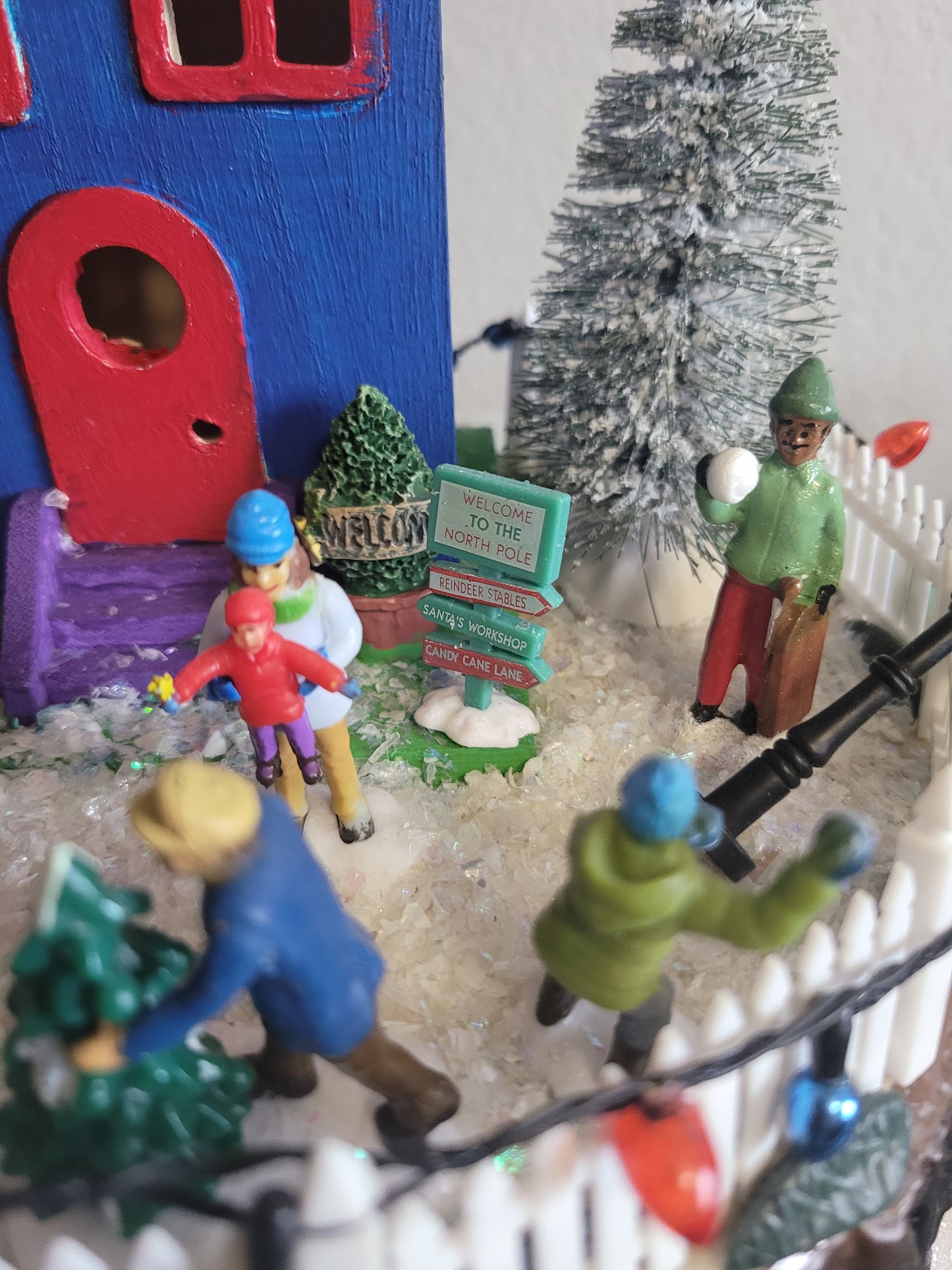 Toy scene with colorful figurines and holiday feel. 