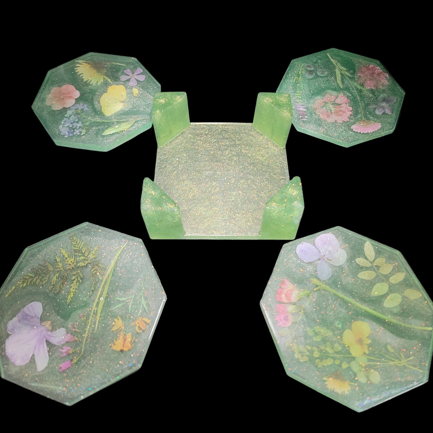 Decorative green floral themed beverage coasters with patterns