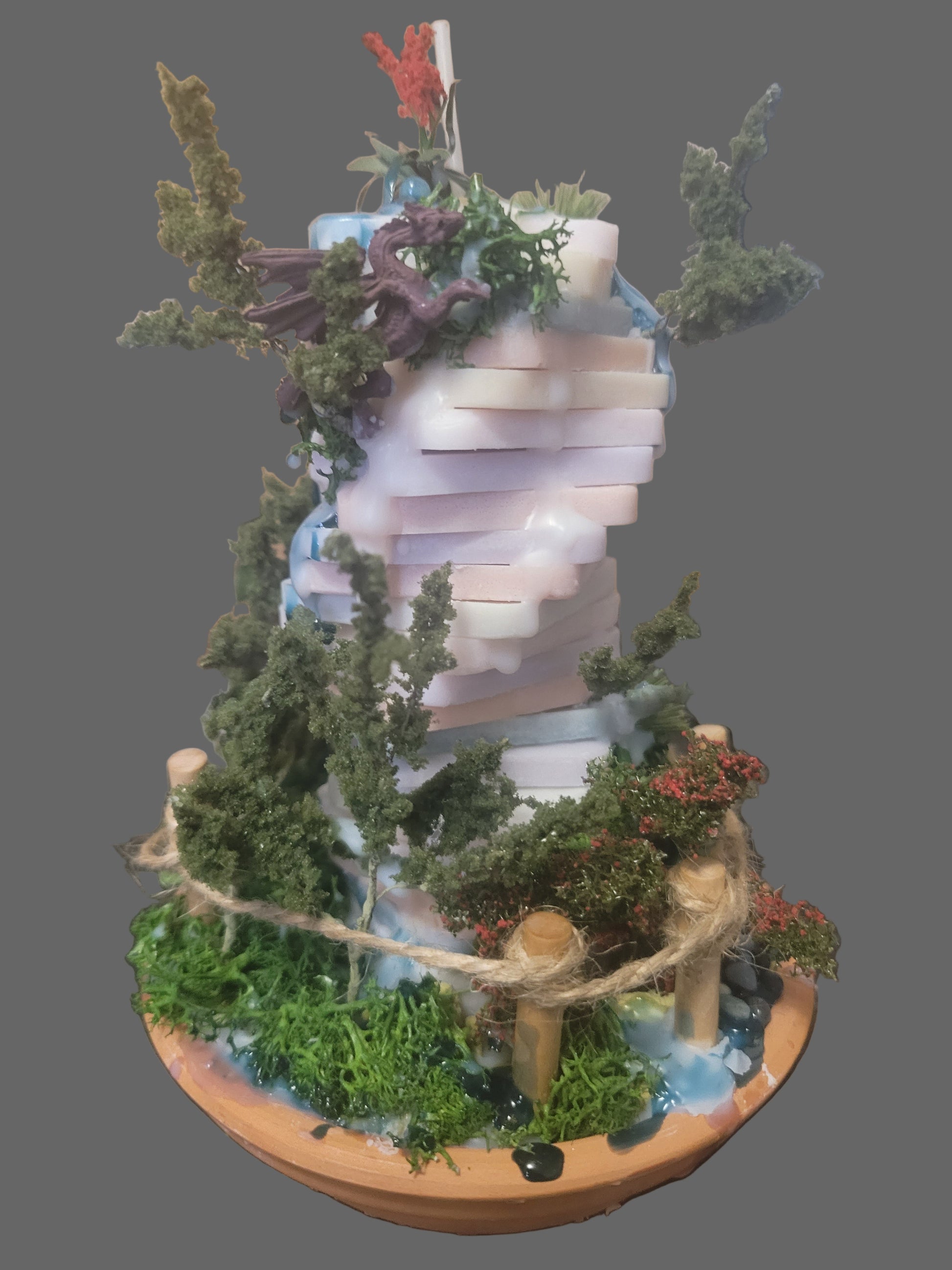 Decorative garden with dragons on a hand poured tower spiral candle. Centerpiece for your table.