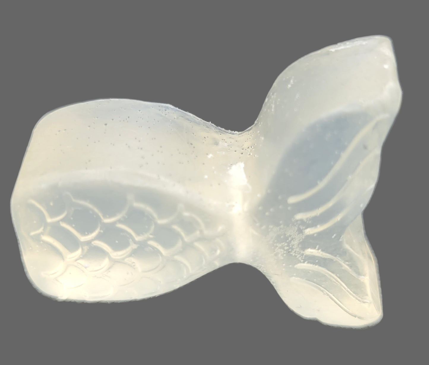 Clear glycerin soap shaped like a mermaid tail. pack of 2.