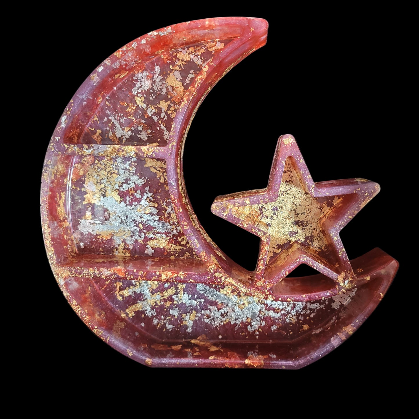 Decorative resin shelf or hanging wall art with a rusted moon and star design.
