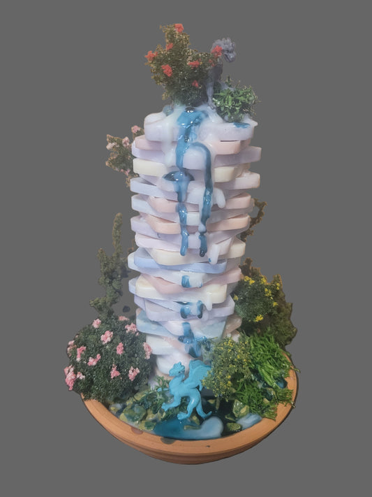 Fantasy scene with hand made offset tower candle. Dragons