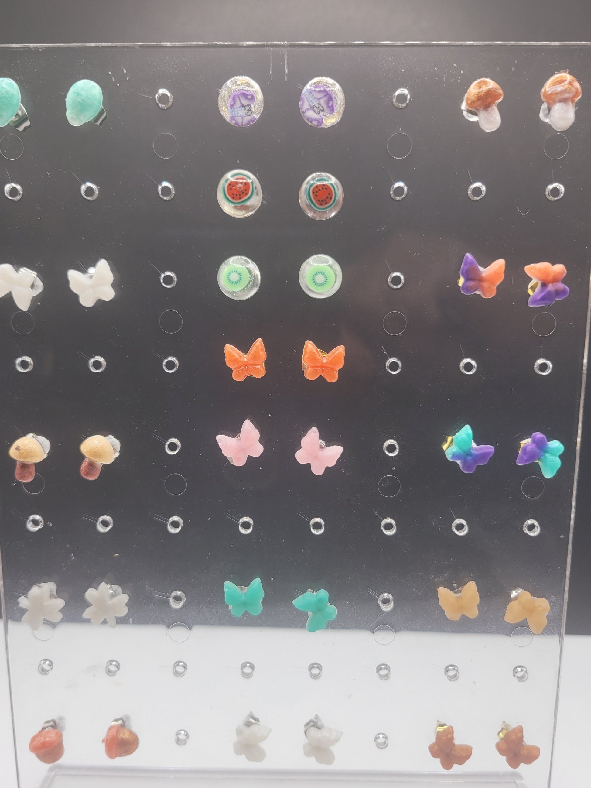 Earring display board with various colorful stud earrings